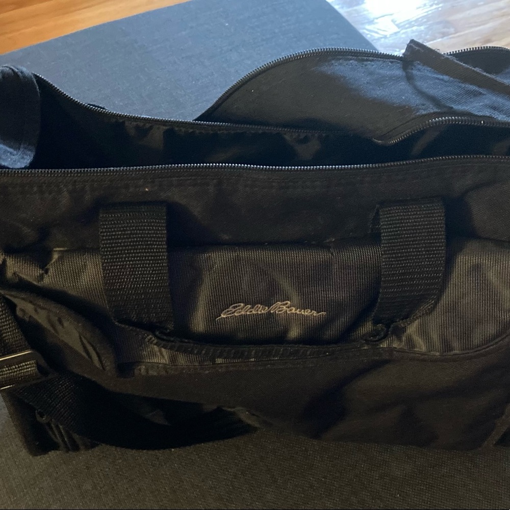 Black Eddie Bauer Diaper Bag With Disposable Bag Dispenser Included.